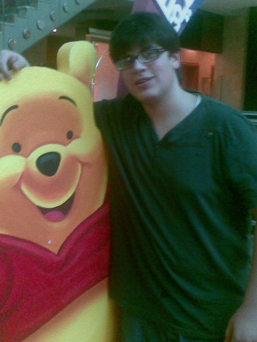 Sid as a teenager, leaning on a Winnie the Pooh cutout